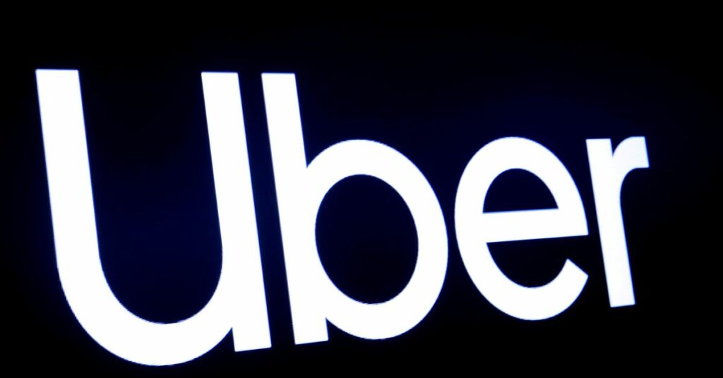 A screen displays the company logo for Uber Technologies Inc at the New York Stock Exchange (NYSE) in New York, U.S., May 10, 2019. REUTERS/Brendan McDermi