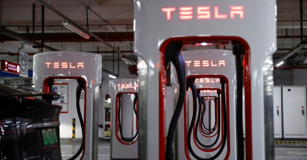 Tesla charging stations are pictured in a parking lot in Shanghai, China March 13, 2021. REUTERS/Aly Song