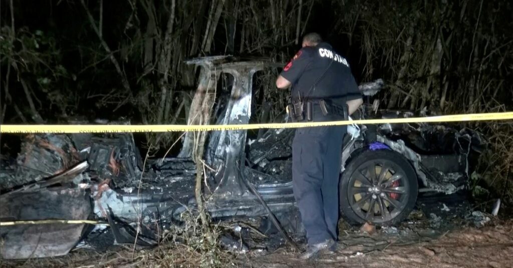 The remains of a Tesla vehicle are seen after it crashed in The Woodlands, Texas, April 17, 2021, in this still image from video obtained via social media. Video taken April 17, 2021. SCOTT J. ENGLE via REUTERS
