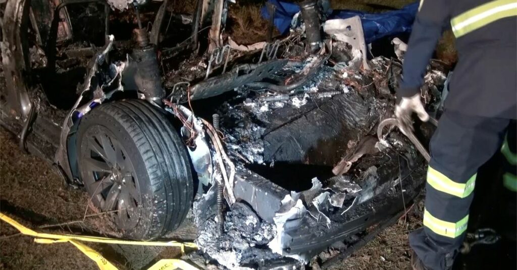 The remains of a Tesla vehicle are seen after it crashed in The Woodlands, Texas, April 17, 2021, in this still image from video obtained via social media. Video taken April 17, 2021. SCOTT J. ENGLE via REUTERS
