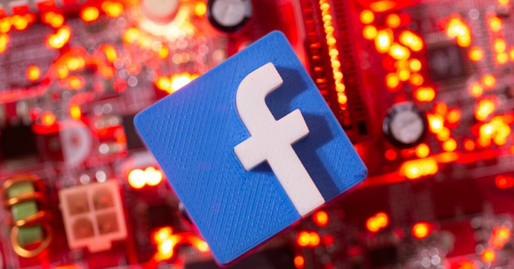 A 3D printed Facebook logo is placed on a computer motherboard in this illustration taken January 21, 2021. REUTERS/Dado Ruvic/Illustration/File Photo