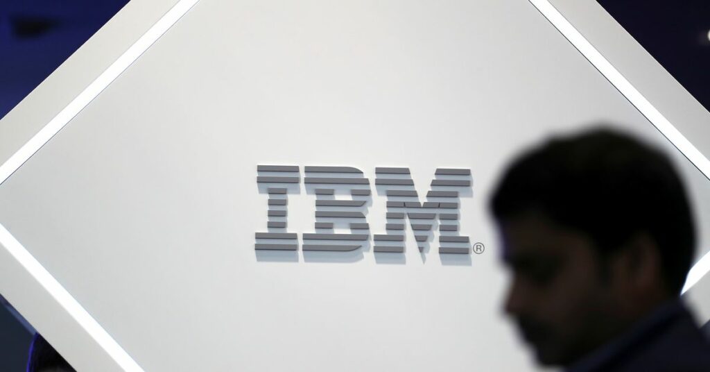 A man stands near an IBM logo at the Mobile World Congress in Barcelona, Spain, February 25, 2019. REUTERS/Sergio Perez