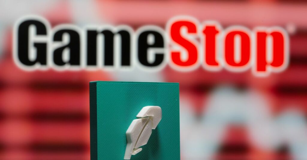 A 3d printed Robinhood logo is seen in front of displayed GameStop logo in this illustration taken February 8, 2021. REUTERS/Dado Ruvic/Illustration