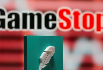 A 3d printed Robinhood logo is seen in front of displayed GameStop logo in this illustration taken February 8, 2021. REUTERS/Dado Ruvic/Illustration