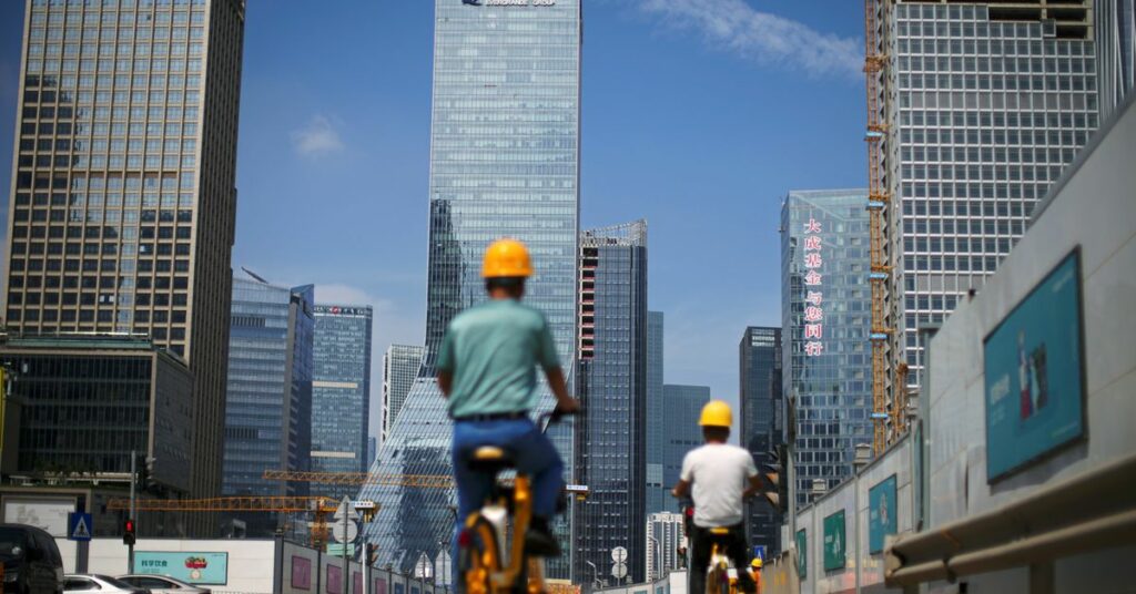The China Evergrande Centre building sign is seen in Hong Kong, China September 23, 2021. REUTERS/Tyrone Siu