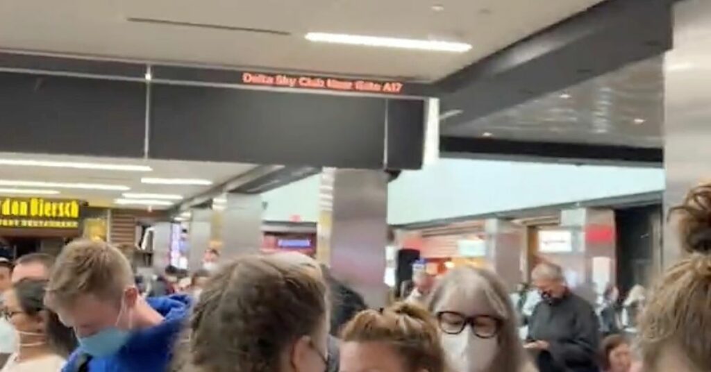 People gather to leave Hartsfield-Jackson Atlanta International Airport after reported shooting, in Atlanta, Georgia, U.S., November 20, 2021, in this still image obtained from a social media video. Twitter/mohiterajas/via REUTERS