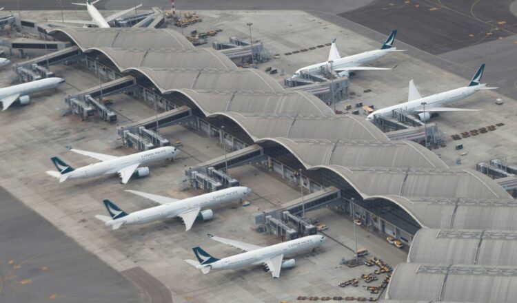 Cathay Pacific planes are parked on the tarmac at Hong Kong International Airport, Hong Kong, China October 24 2020. REUTERS/Tyrone Siu/File Photo