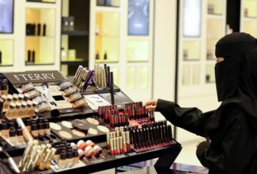 A Saudi woman arranges the perfumes in a cosmetic shop at Centria Mall in Riyadh, Saudi Arabia, October 22, 2021. REUTERS/Ahmed Yosri