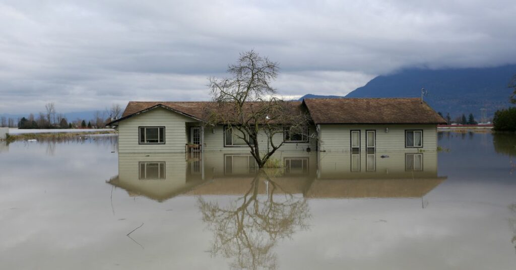 Pumpkins and a propane tank float in flood waters outside a farm in the Yarrow neighbourhood after rainstorms caused flooding and landslides in Chilliwack, British Columbia, Canada November 20, 2021.  REUTERS/Jesse Winter