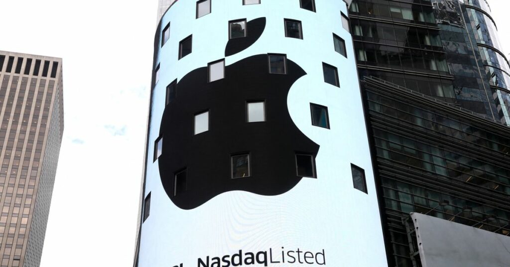 An electronic screen displays the Apple Inc. logo on the exterior of the Nasdaq Market Site following the close of the day