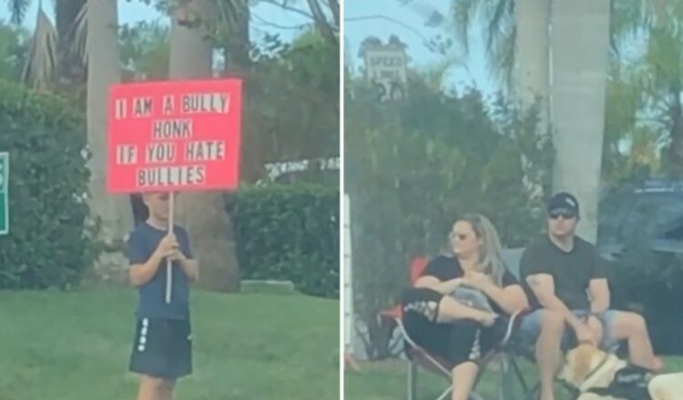 Los padres provocan un debate mientras un niño sostiene un cartel de matón al costado de la carretera