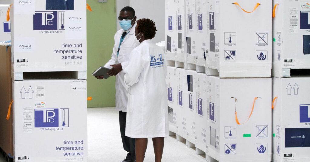 Biomedical engineers confirms a consignment of AstraZeneca/Oxford vaccines under the COVAX scheme against coronavirus disease (COVID-19), before distribution at the Kitengela cold rooms stores in Kitengela, outside Nairobi, Kenya March 4, 2021. REUTERS/Monicah Mwangi