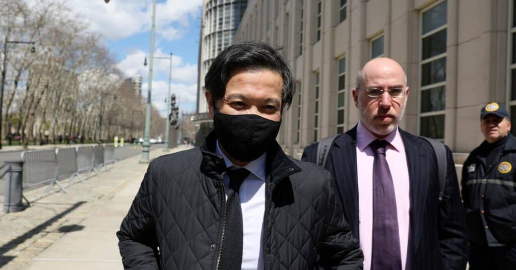 Ex-Goldman Sachs banker Roger Ng and his lawyer Marc Agnifilo leave the federal court in New York