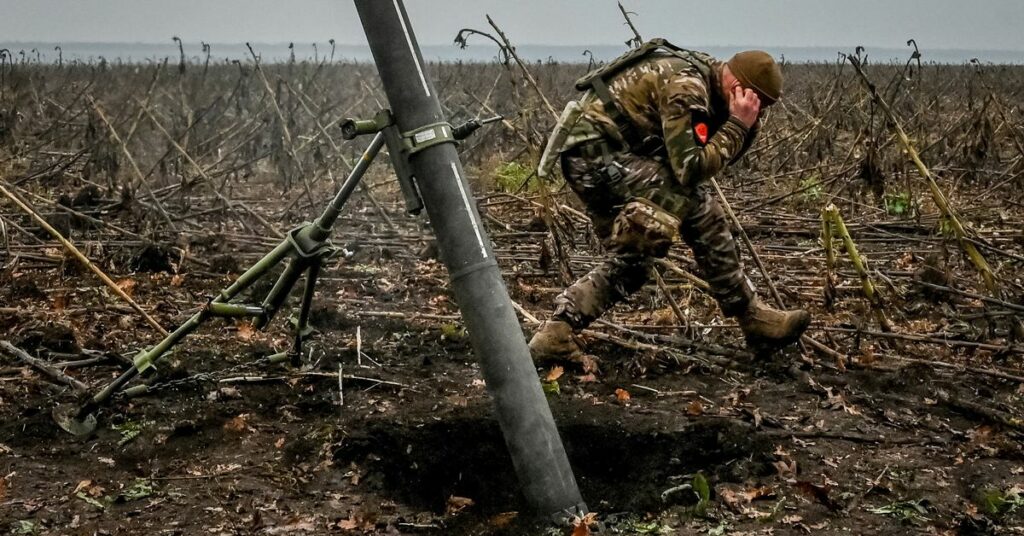 Ukrainian servicemen fire a mortar on a front line in Zaporizhzhia region