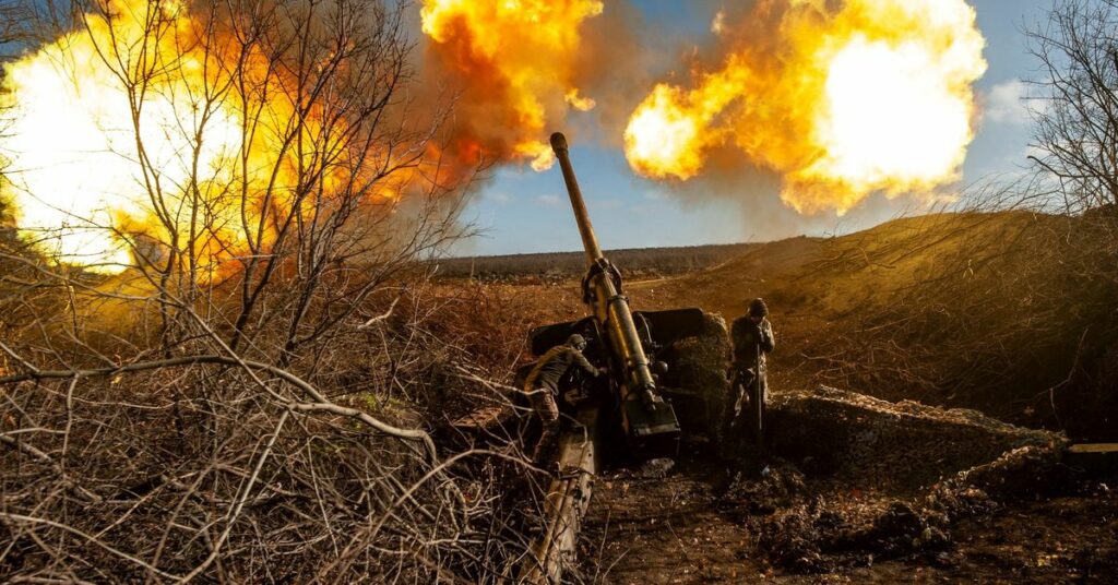 Ukrainian servicemen fire a 130 mm towed field gun M-46 on a front line near Soledar