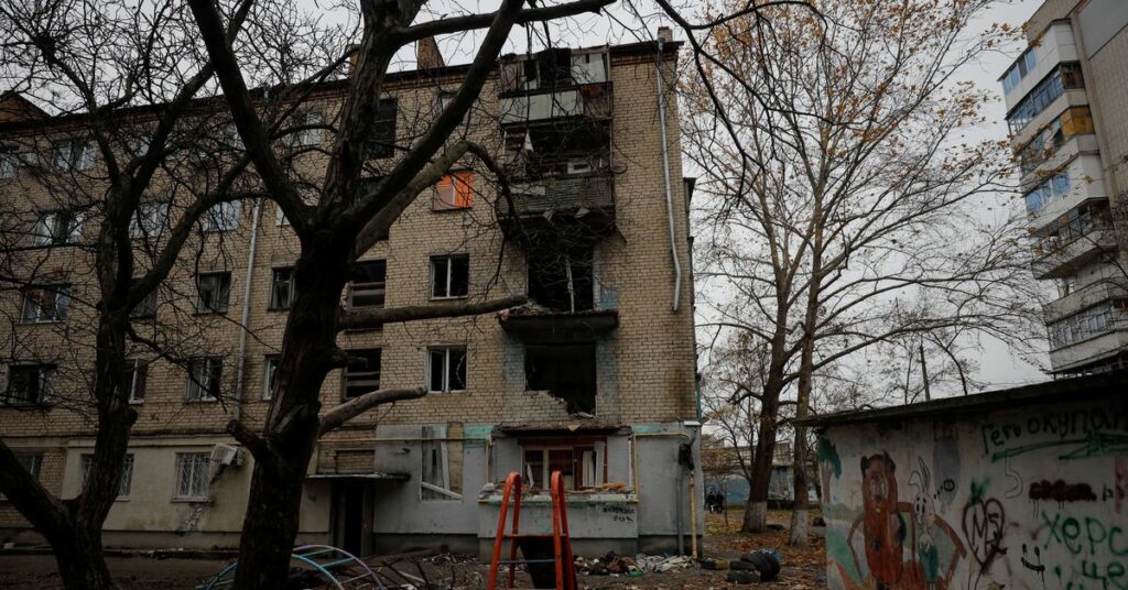 View shows an apartment building damaged by a recent Russian military strike in Kherson