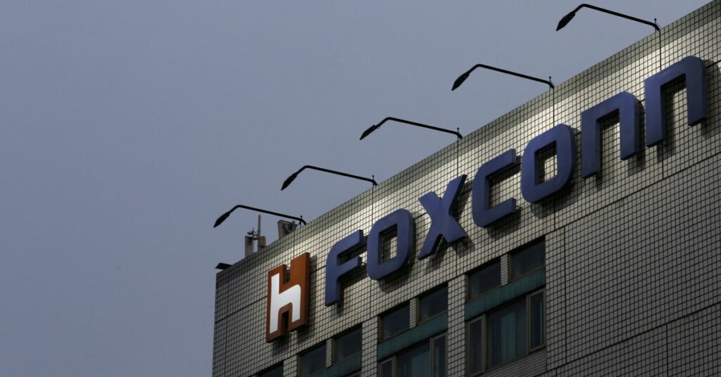 The logo of Foxconn, the trading name of Hon Hai Precision Industry, is seen on top of the company