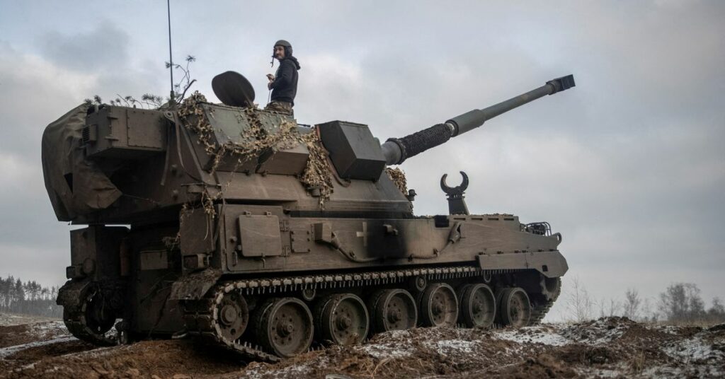 Ukrainian servicemen prepare a Polish self-propelled howitzer Krab to fire toward Russian positions on a frontline in Donetsk region
