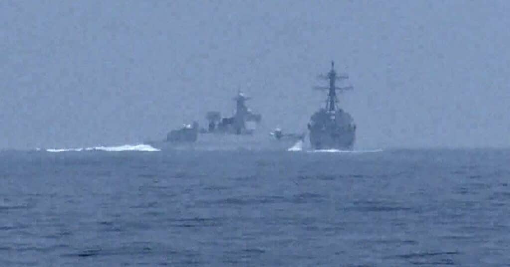 Chinese warship crosses the path of U.S. Navy destroyer USS Chung-Hoon in the Taiwan Strait