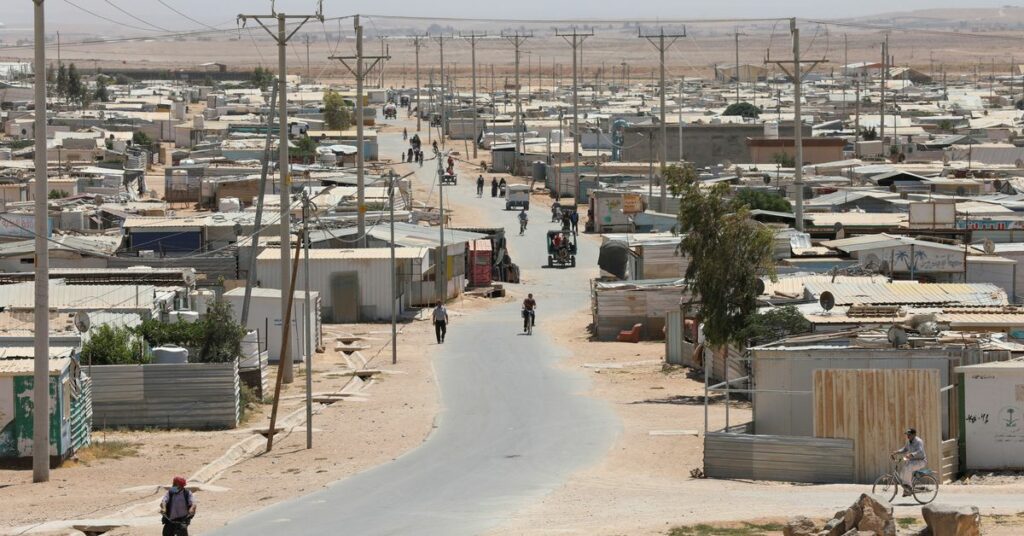 Syrian refugees are seen at the Zaatari refugee camp in the Jordanian city of Mafraq