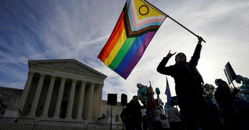 Activists gather outside U.S. Supreme Court as justices hear arguments in case involving LGBT rights in Washington